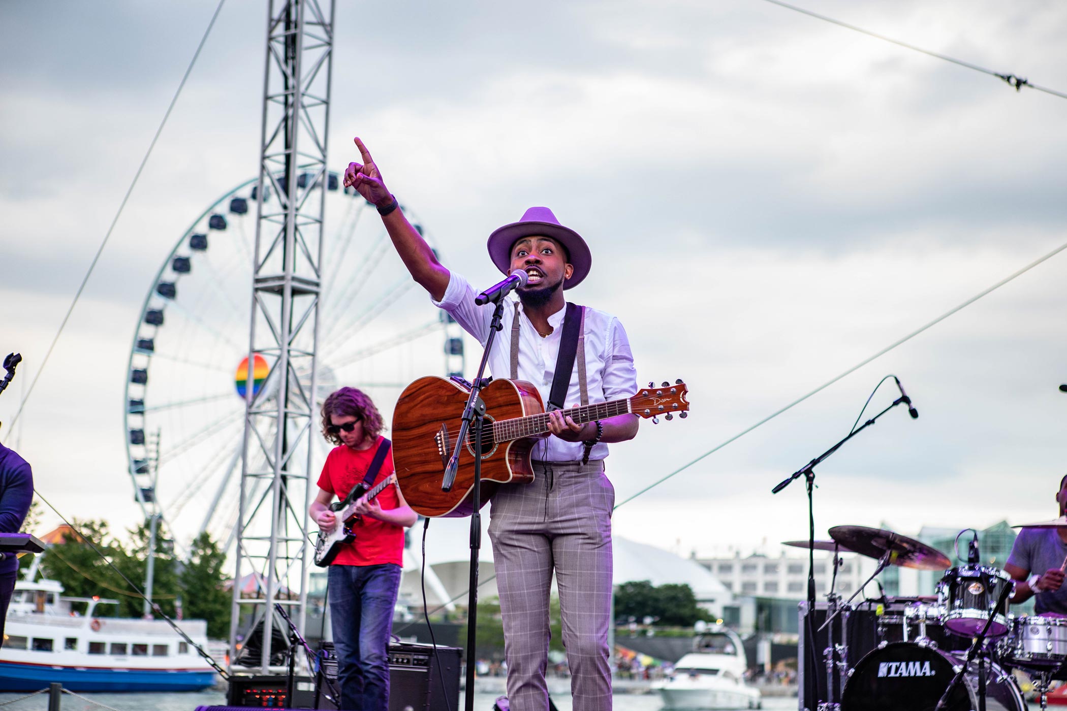 Man Playing Guitar and Singing On Stage at Navy Pier